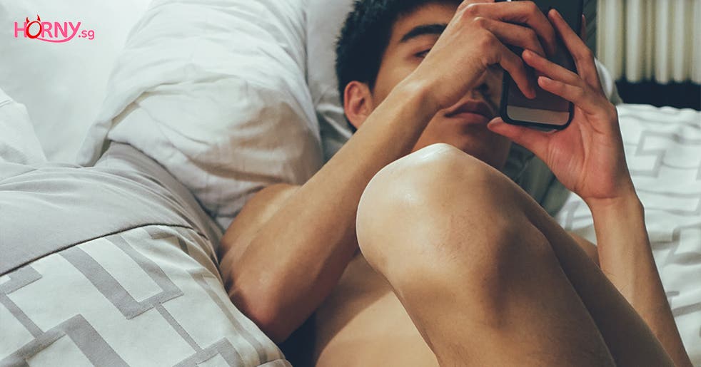 Man Sexting on the bed