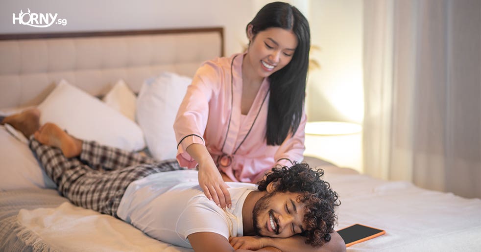  a girl massaging her boyfriend-sex toys singapore