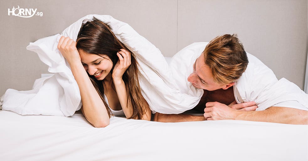 couple talking in bed-sex toys singapore